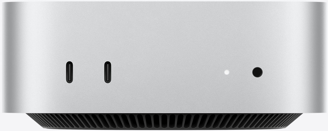 Mac mini M4 正面：银色铝金属机身、双 USB-C、状态灯、耳机接口与底部通风结构